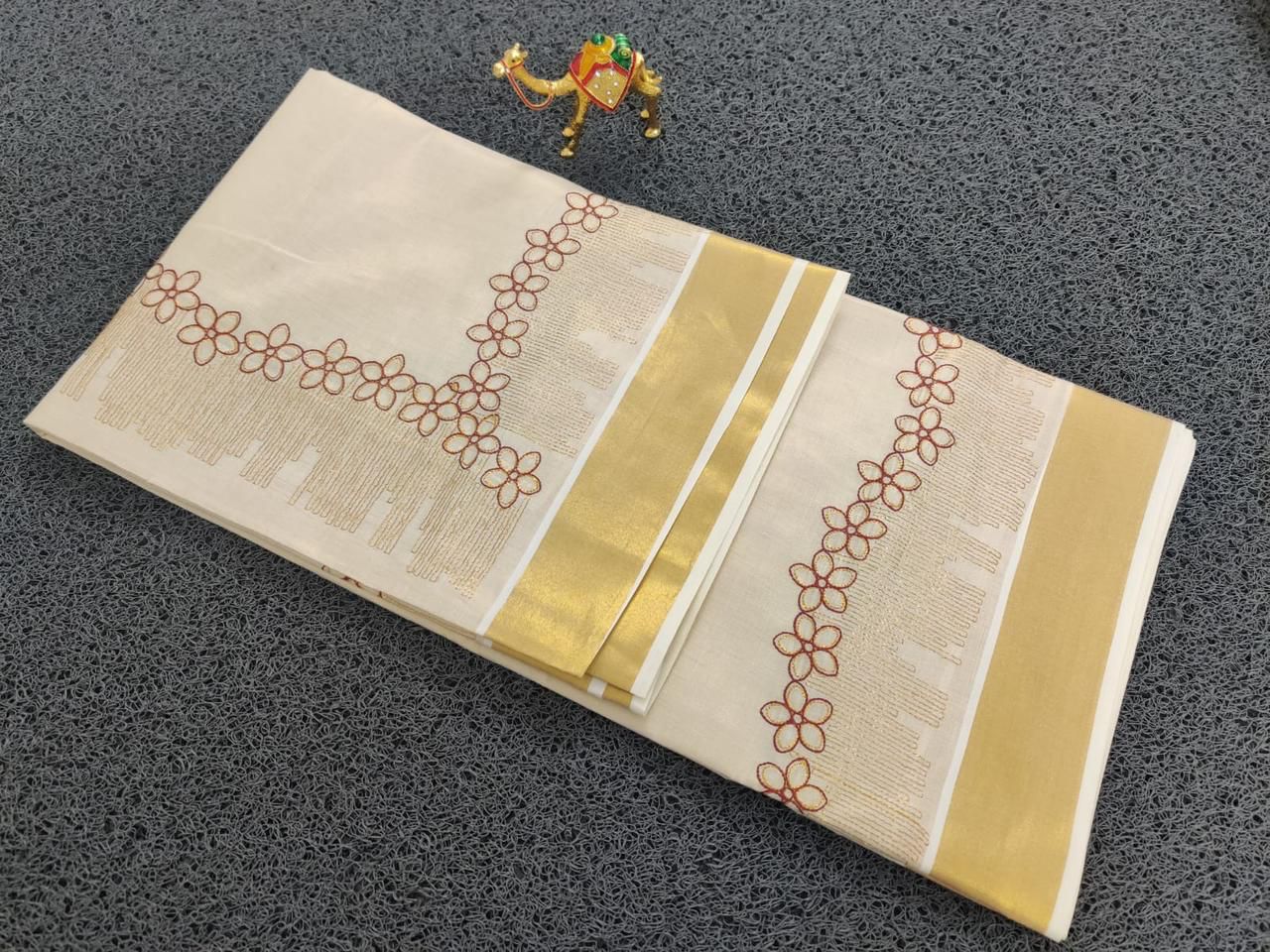 Flower shed golden tissue emroidered saree