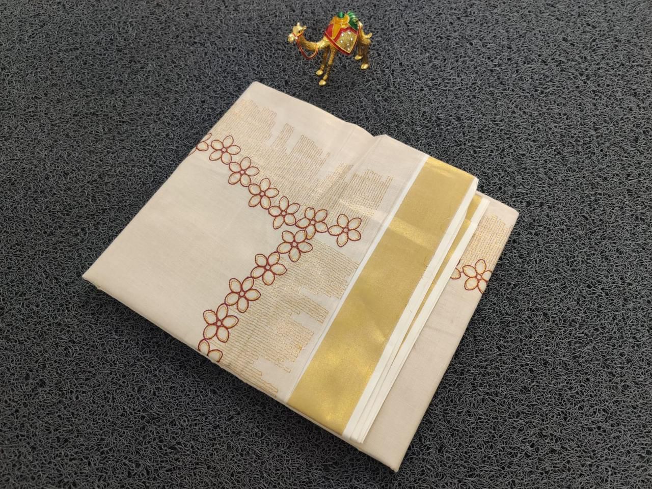 Flower shed golden tissue emroidered saree