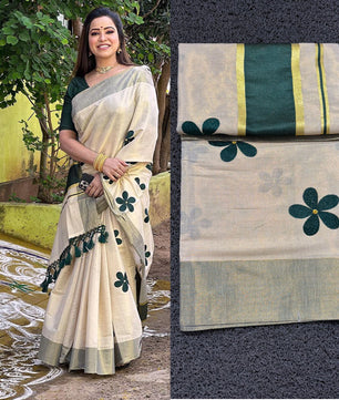 Green flower embro golden tissue saree with tussles.