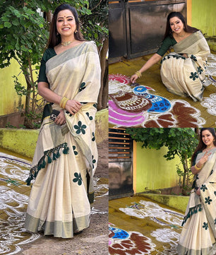 Green flower embro golden tissue saree with tussles.