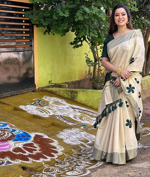 Green flower embro golden tissue saree with tussles.