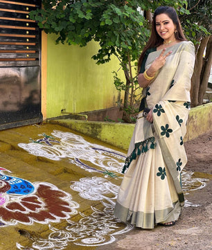Green flower embro golden tissue saree with tussles.