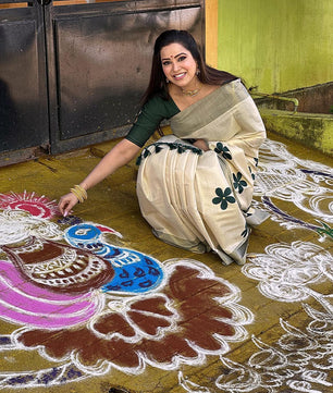 Green flower embro golden tissue saree with tussles.