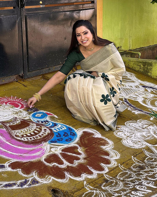 Green flower embro golden tissue saree with tussles.